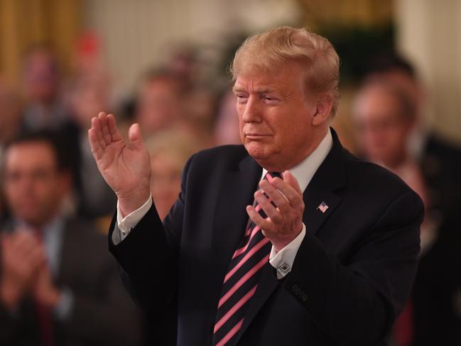 US President Donald Trump gave himself a round of applause at the White House. Picture: AFP