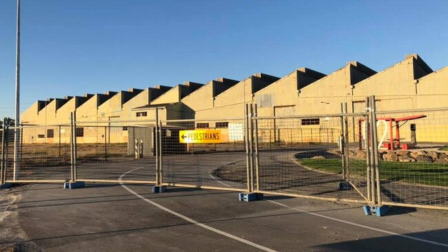 Fencing has gone up around Shed 26 at Port Adelaide. Photo: Emma Webb