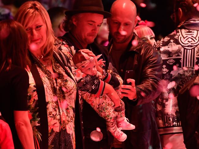 Camilla’s fiance JP Jones watched on with their daughter Luna Gypsy in the huge crowd. Picture: Stefan Gosatti/Getty Images