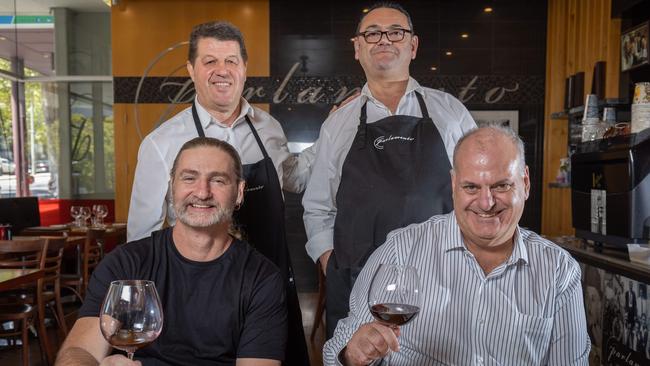 Gabriele Bibbo, front left, Raffaele Simeone and Danny Rattenni, back, with David Basheer, front right, at North Tce restaurant Parlamento. Picture: Ben Clark