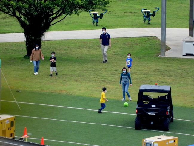 Australians evacuated from China play outside to stave off boredom while quarantined at Christmas Island. Picture: Nathan Edwards