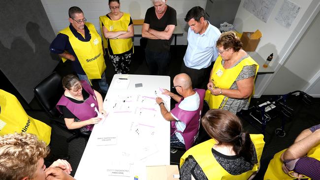 Gaven candidates Michael Riordan ALP (black shirt) and Sid Cramp LNP (blue shirt) during the tense 2015 vote count. Picture Glenn Hampson