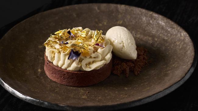 Chocolate tart with ginger caramel and honey cream. Picture: Markus Ravik