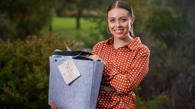 Stephanie-Jo Malan with one of her gift bags supporting new mums. Picture: Matt Turner