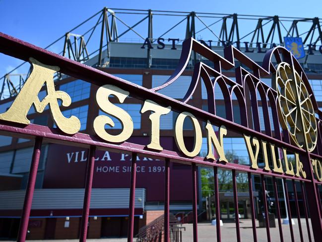 The gates of Aston Villa football club's stadium, Villa Park are pictured in the spring sunshine in Birmingham, central England on April 19, 2020, during the novel coronavirus COVID-19 pandemic. - Premier League clubs remain committed to finishing the top-flight season but did not set a June 30 deadline to complete the fixture list at a meeting on Friday. With the English top flight on ice since mid-March due to the coronavirus, it had been reported that as many as nine clubs were keen to complete the campaign by the end of June. But it is understood that the 20 clubs did not discuss wrapping up the remaining 92 Premier League fixtures by then when they met on a conference call with league chiefs. (Photo by Paul ELLIS / AFP)