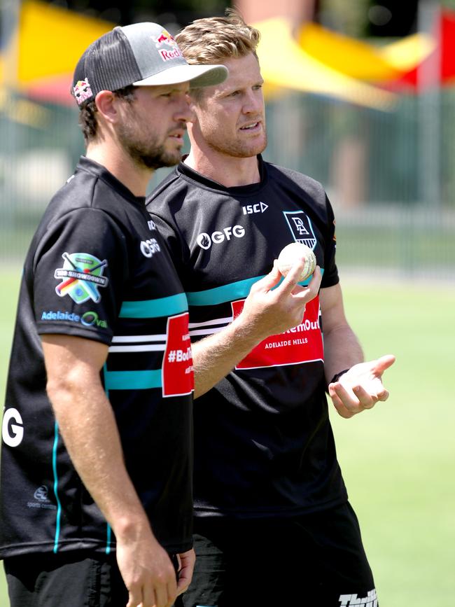 Travis Boak and Tom Jonas chat during Tuesday’s net session. Picture: AAP/Kelly Barnes