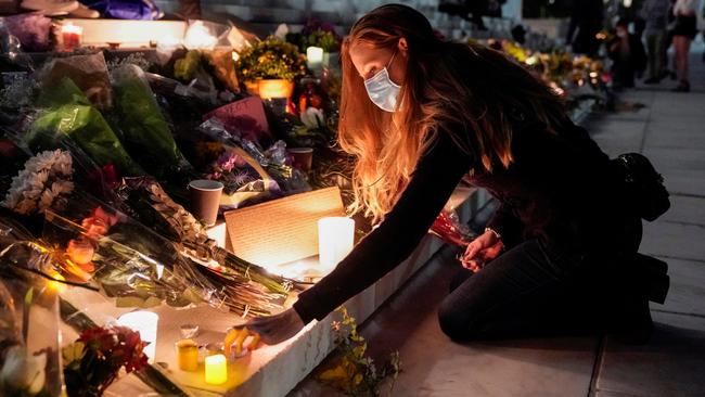 A candle is light to mourn Justice Ruth Bader Ginsburg outside the Supreme Court in Washington on Sunday. Picture: Reuters