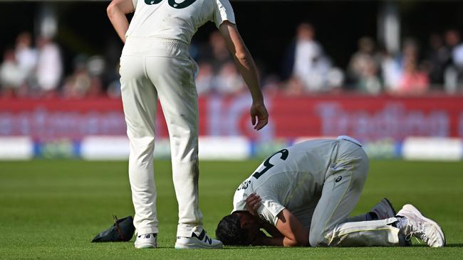 Cold shoulder: Fastman Mitchell Starc’s injury while fielding could be another nail in Australia’s coffin in the Fourth Test of The Ashes at Old Trafford. Picture: AFP