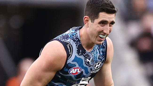 Weitering heads to the bench after injuring his shoulder during the first quarter. Picture: Michael Klein