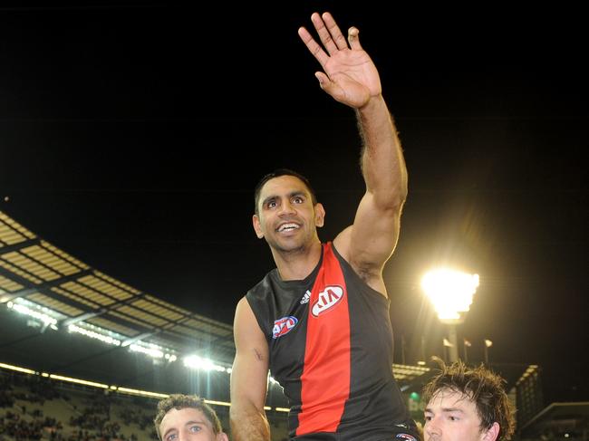 Nathan Lovett-Murray of Essendon is carried off the ground by team-mates after he retired from the game, after the Round 23 AFL match between the Essendon Bombers and the Richmond Tigers at the MCG in Melbourne, Saturday, Aug. 31, 2013. (AAP Image/Joe Castro) NO ARCHIVING, EDITORIAL USE ONLY