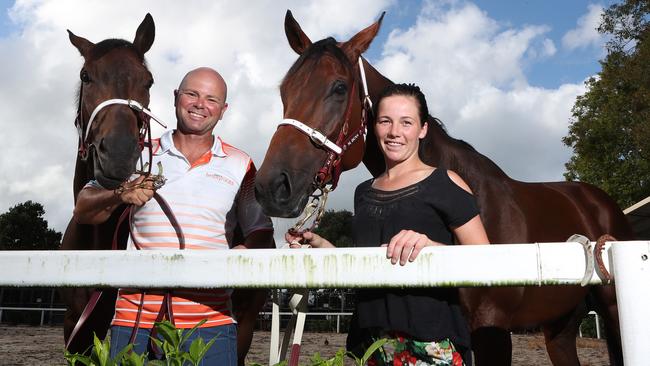 Murwillumbah trainer Matthew Dunn and wife Keira Dunn with Perfect Dane and Delightful Feeling. Photo: Scott Fletcher.