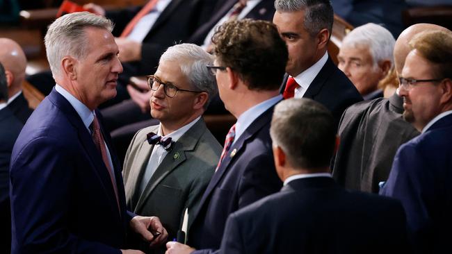 Kevin McCarthy (L) talks with Rep. Patrick McHenry (2nd L) and fellow Republicans in between roll call votes for Speaker of the House. Picture: Getty Images via AFP.