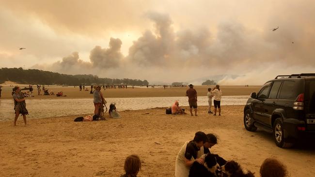 Residents watch the bushfire’s progress at Lake Conjola.