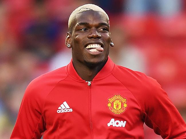 MANCHESTER, ENGLAND - AUGUST 19: Paul Pogba of Manchester United warms up prior to the Premier League match between Manchester United and Southampton at Old Trafford on August 19, 2016 in Manchester, England. (Photo by Michael Regan/Getty Images)