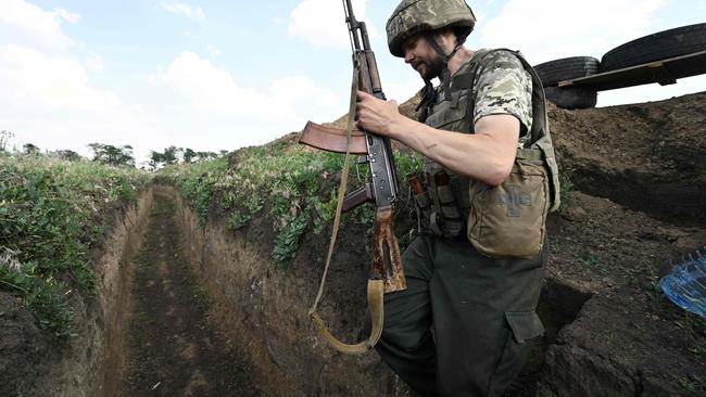 A Ukrainian serviceman walks in a trench between the southern cities of Mykolaiv and Kherson this week. Picture: AFP