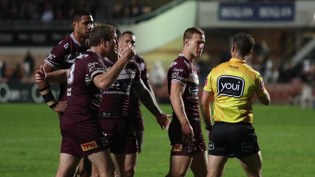 Manly's Daly Cherry-Evans continues the discussion with referee Grant Atkins after the full-time siren has sounded following the loss to Newcastle at Lottoland. Picture: Brett Costello