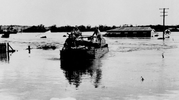 Ferry Street, Maryborough during the 1955 flood. Floodwaters engulf Ferry Street, leaving only the rooftops visible. Source: Maryborough Wide Bay &amp; Burnett Historical Society