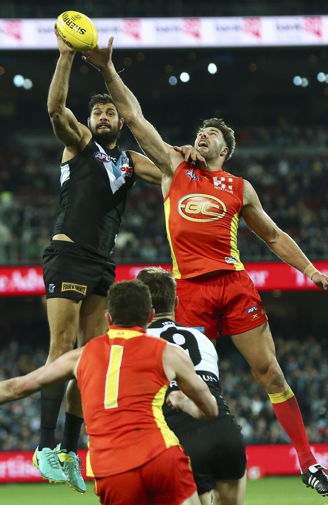 Brooksby competes with Port Adelaide’s Paddy Ryder during his time at the Gold Coast. Picture: Sarah Reed