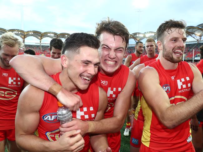 GOLD COAST, AUSTRALIA - APRIL 14: Suns celebrate winning the round four AFL match between the Gold Coast Suns and the Carlton Blues at Metricon Stadium on April 14, 2019 in Gold Coast, Australia. (Photo by Chris Hyde/Getty Images)