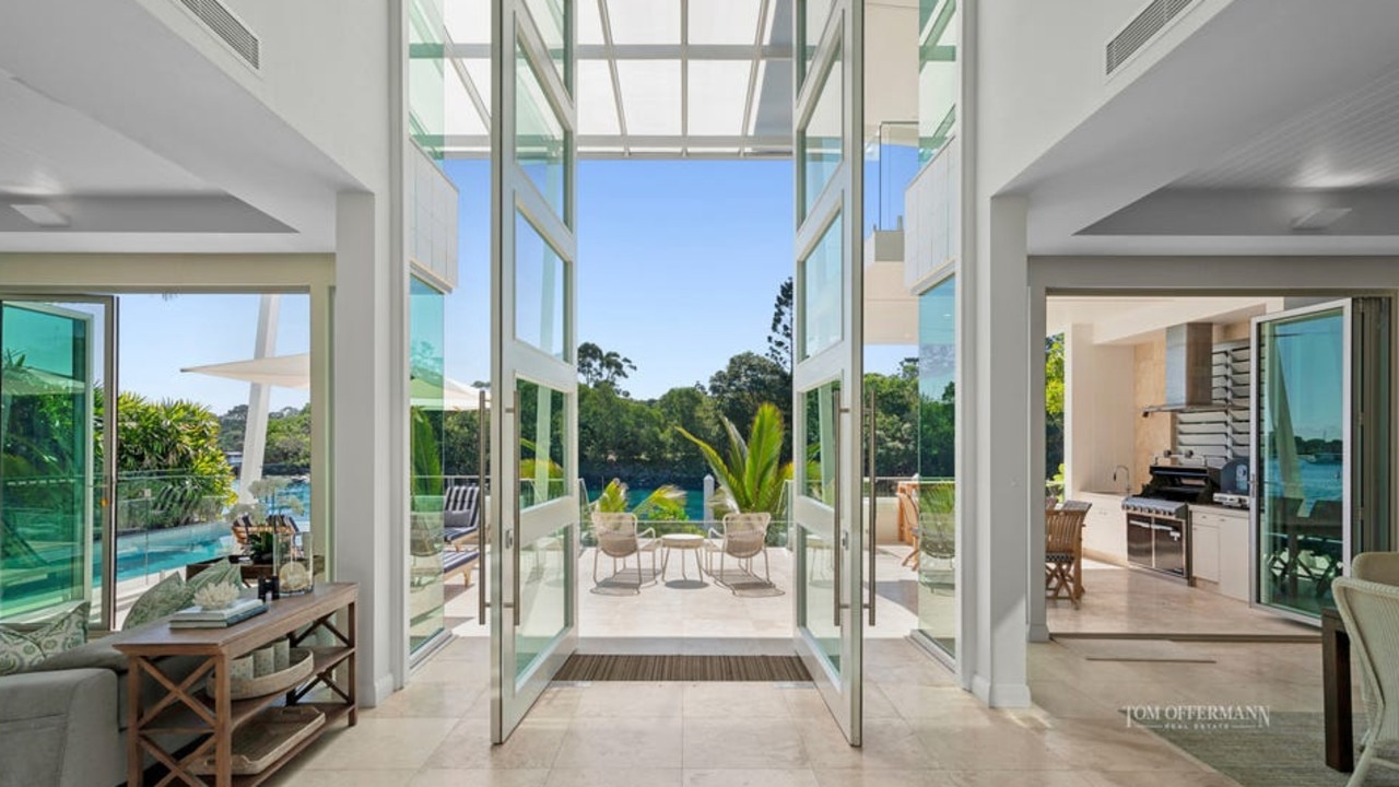 Inside the stunning home which makes grand use of glass to make the most of its location. Picture: Tom Offermann Real Estate