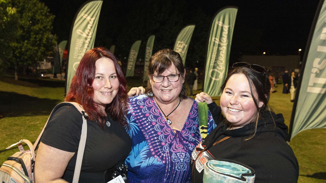 Tracey Webb with her daughters Alisha Hughes (left) and Jasmine Hughes at the Symphony Under the Stars concert performed by the Queensland Symphony Orchestra in Queens Park Amphitheatre for Carnival of Flowers, Friday, October 4, 2024. Picture: Kevin Farmer