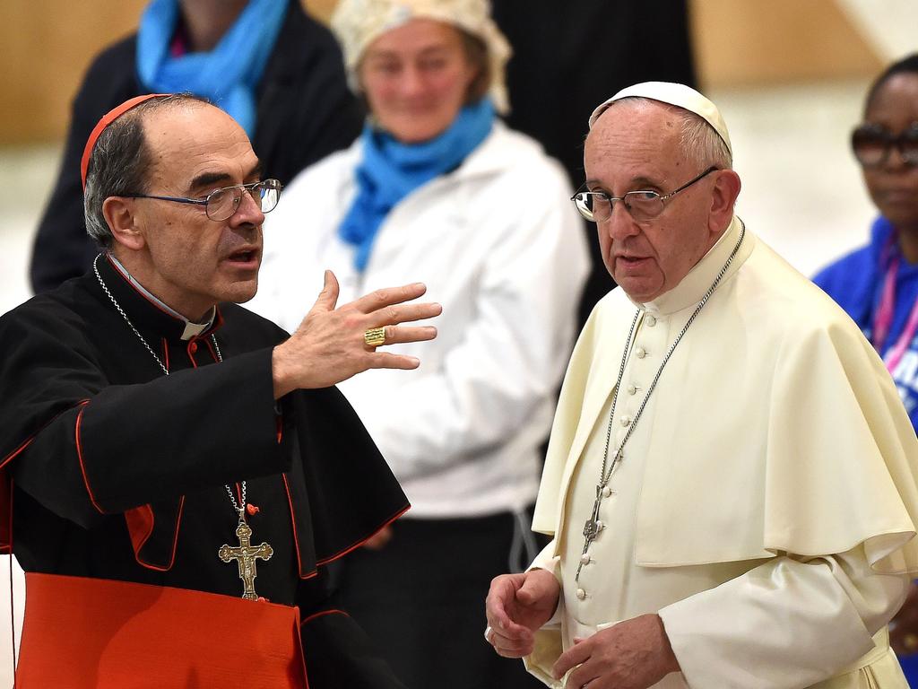 Pope Francis (R) listens to French Cardinal Philippe Barbarin during an audience with homeless and socially excluded people in November 2016 at the Vatican. Picture: AFP