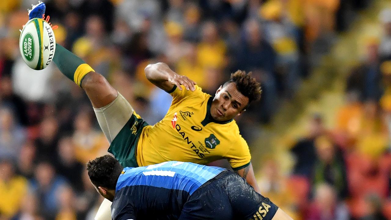 Will Genia of the Wallabies flies for the ball over Joaquin Tuculet of the Pumas.