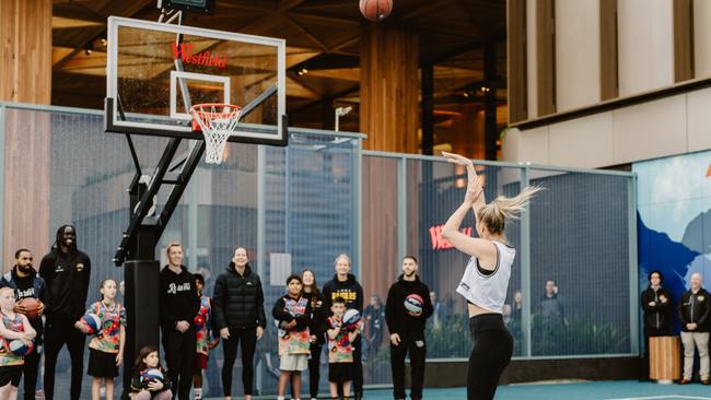 Aussie basketball star Bec Cole taking the first shot.