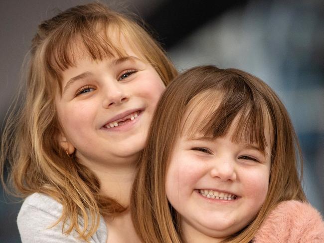 MELBOURNE, OCTOBER 5, 2022: Victoria's First Aid Champion Awards at South Wharf. Emilie Hook (grey top), 6, from Ballarat, pictured sister Ella (pink jacket), 5. Emilie and mother Amy used first aid to save Ella after finding her blue and unresponsive. Picture: Mark Stewart