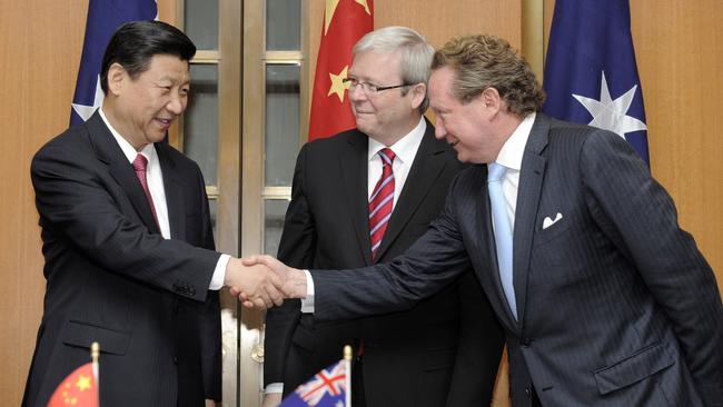 Xi Jinping shakes hands with Fortescue Metals Group CEO Andrew Forrest as then prime minister Kevin Rudd looks on in 2010. Picture: AP