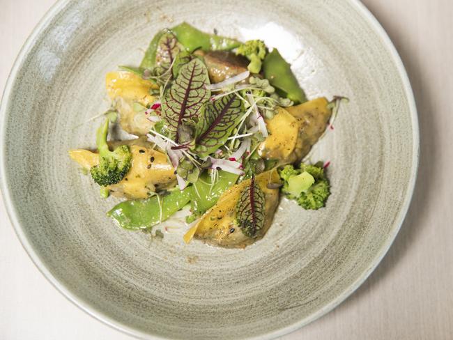 Spinach and Shiitake Dumplings with Miso burnt butter, sesame broccoli and snow peas at Bistro C in Noosa. Photo: Lachie Millard