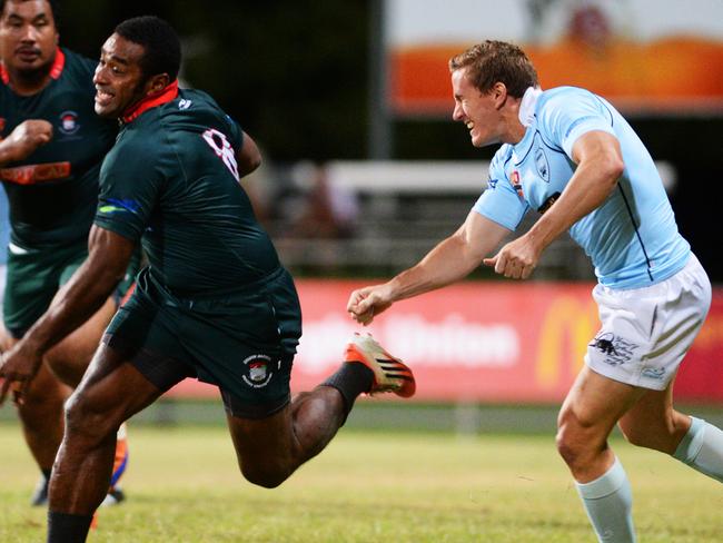 NT Rugby Union South Darwin vs Casuarina: Southern Darwin player Lepani Nabuliwaqa breaks away from Casuarina player Shane Crowley