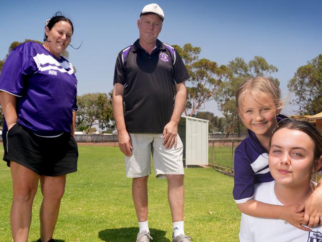 Future SA Projects - Port Augusta - Greg Bailey, his niece Rheanon Bailey,37, and her daughters, Harley Rose Bailey,14, and Mia Bailey,6, at the West Augusta football oval. They are optimistic that a new power plant would be good for the town. 7 February 2025. Picture: Dean Martin