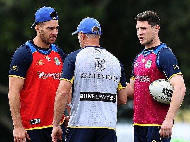 Parramatta's Corey Norman and Mitchell Moses talk with coach Brad Arthur. Picture: Brett Costello