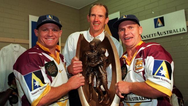 Kevin Walters, Wayne Bennett and Allan Langer celebrate after winning the 1998 premiership with the Brisbane Broncos.