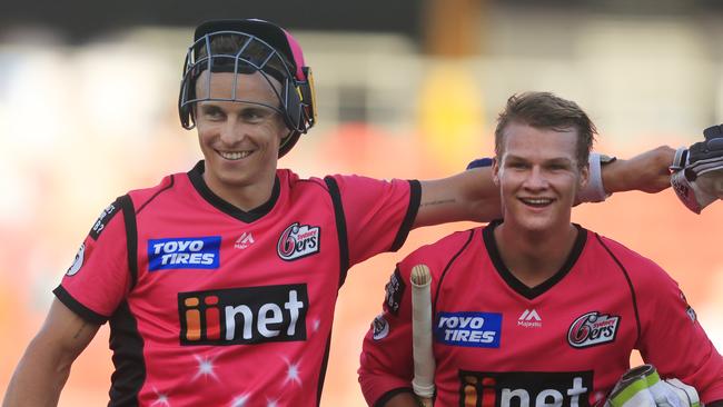 Tom Curran and Josh Philippe celebrate the Sixers’ win over the Brisbane Heat. Picture: Getty