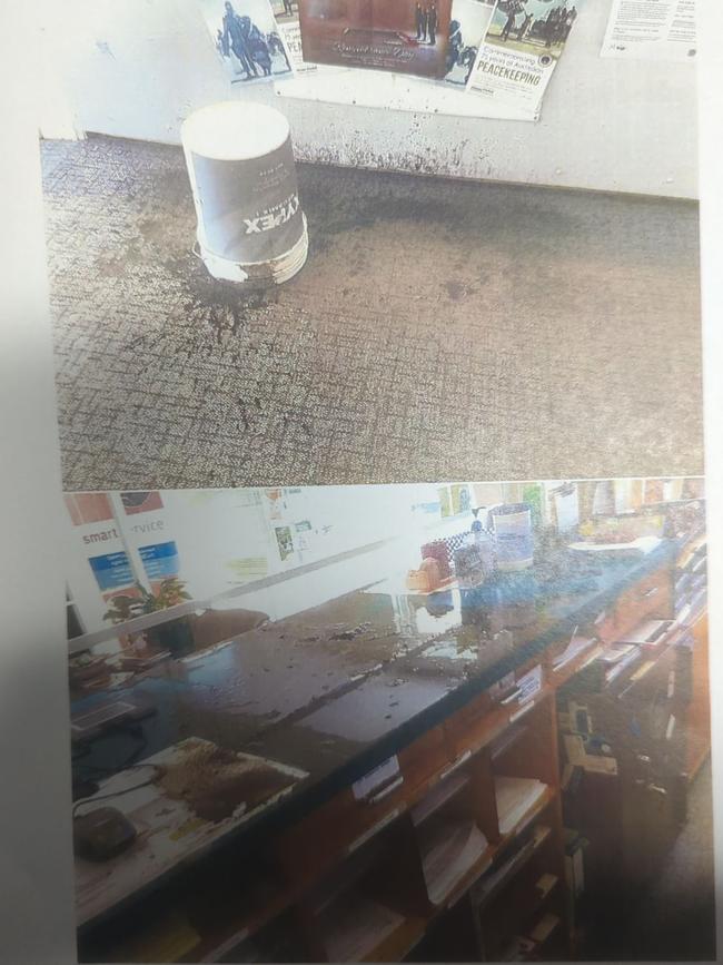 Photos presented to the Chinchilla Magistrates Court showing the damage done to the Miles police station front desk and floor after Sesia was sentenced for dumping a bucket of "matter" on it.