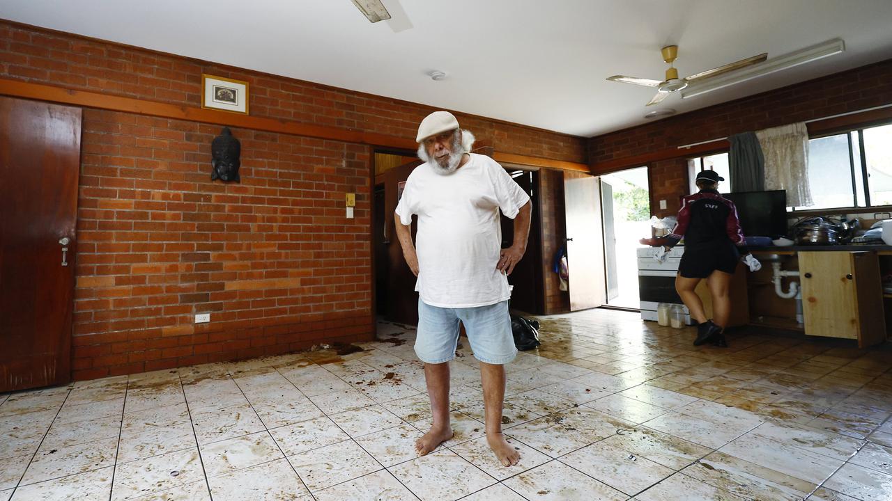 Rob Wellington stands in his muddied Holloways Beach apartment. Picture: Brendan Radke