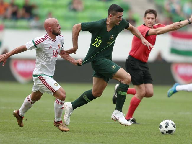 Tom Rogic evades the pressure of Hungary's Jozsef Varga in last week’s friendly. Pic: AFP