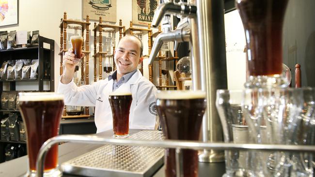 Cheers, head trainer Jon Saroglu with the trendy beer-like cold brew. Picture: Troy Snook