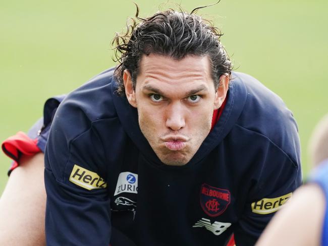 Harley Bennell reacts when warming up during an AFL Melbourne Demons training session at Casey Fields in Melbourne, Thursday, June 25, 2020. (AAP Image/Michael Dodge) NO ARCHIVING