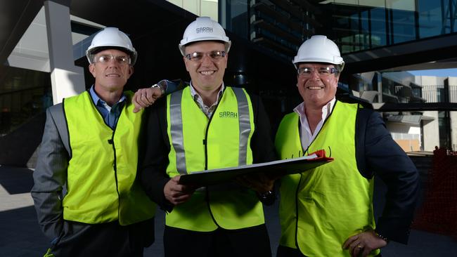 Sarah Constructions chief executive Adrian Esplin, centre, with directors Tim Sarah, left, and James Sarah, right. Picture: Naomi Jellicoe