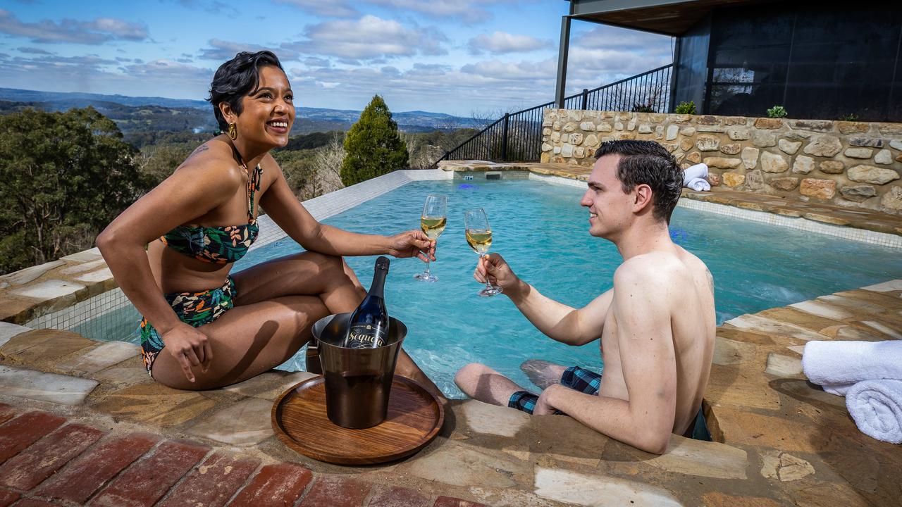 Liinaa Berry and David Schnurr in one of three new spring-fed hot pools, overlooking the Piccadilly Valley, at the new $20m Sequoia Lodge in Crafers. Picture: Tom Huntley