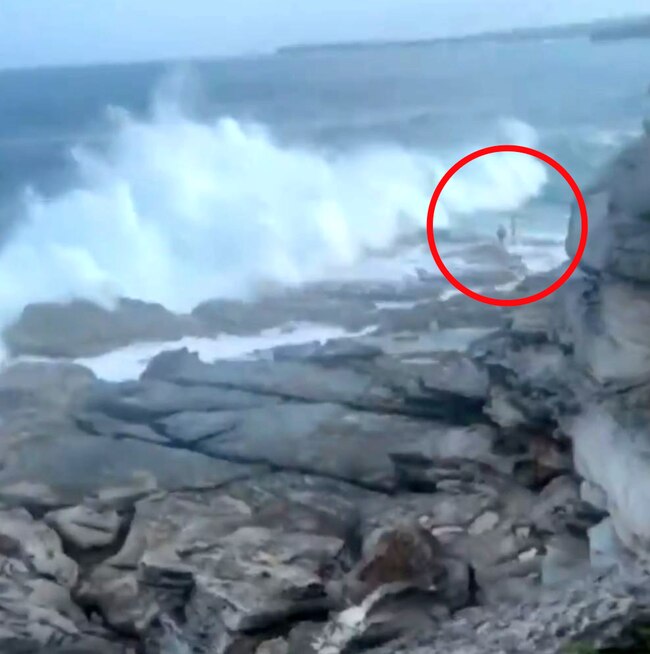 The couple can be seen as the wave rolls in. Picture: 7 News