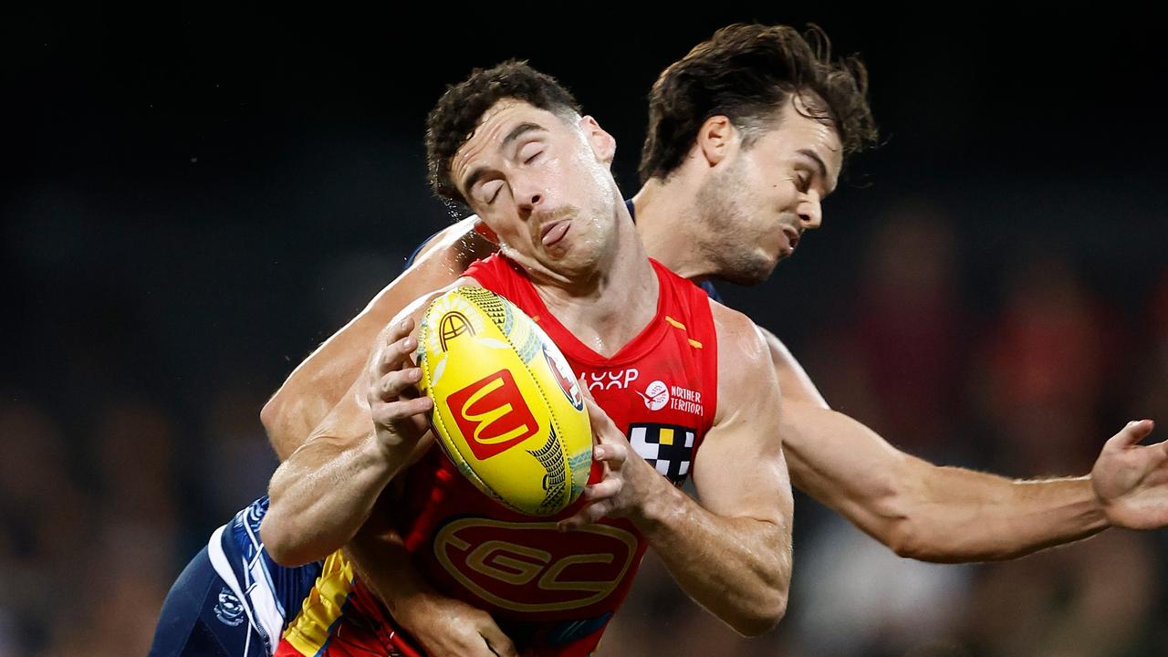 DARWIN, AUSTRALIA - MAY 16: Sam Flanders of the Suns is tackled by Jack Bowes of the Cats during the 2024 AFL Round 10 match between The Gold Coast SUNS and The Geelong Cats at TIO Stadium on May 16, 2024 in Darwin, Australia. (Photo by Michael Willson/AFL Photos via Getty Images)