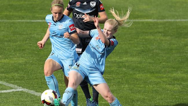 Georgia Yeoman-Dale and Elizabeth Ralston of Sydney FC compete for the ball against Victory.