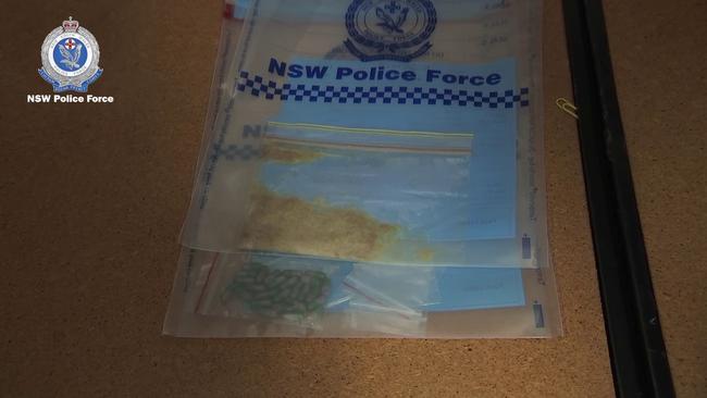 During the search, the officers allegedly found and seized 26 capsules believed to be MDMA.