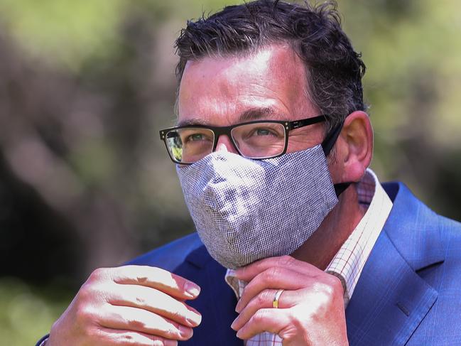 MELBOURNE, AUSTRALIA - JANUARY 14: Premier of Victoria Daniel Andrews adjusts his face masks during a press conference on January 14, 2021 in Melbourne, Australia. Victorian premier Daniel Andrews has announced Victoria's staged return to office work will resume from 18 January as the state continues to record no new COVID-19 cases in the community. (Photo by Asanka Ratnayake/Getty Images)