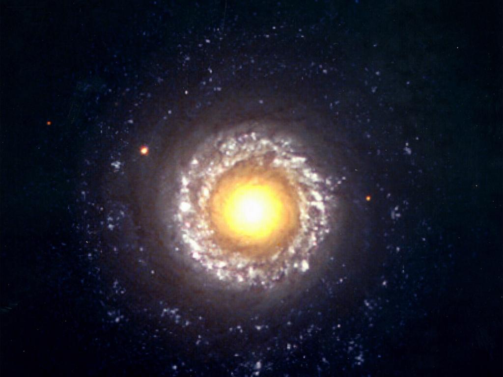 This 1998 Hubble image shows a Seyfert 2 active galaxy, a type that is probably powered by a black hole residing in its core (the large yellow portion C). The lumpy, thick ring around the core is an area of active starbirth about 3,000 light-years from the core.