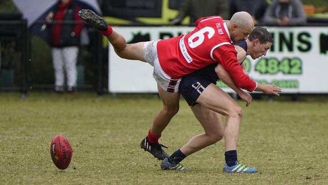 MPNFL: Red Hill’s Jake Mitchell flies over the top. Picture: Valeriu Campan